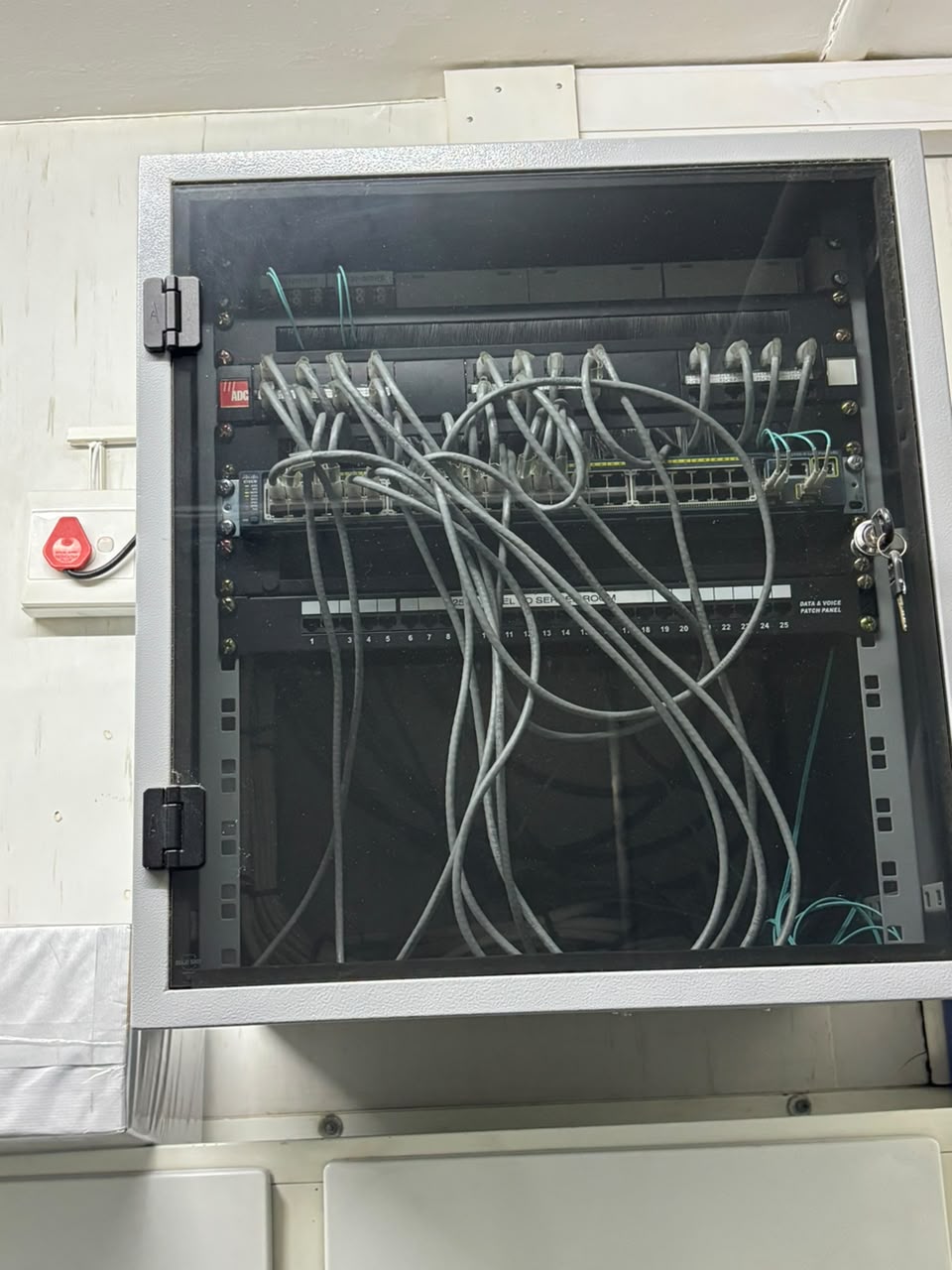 Completed network cabinet and patch panel installation