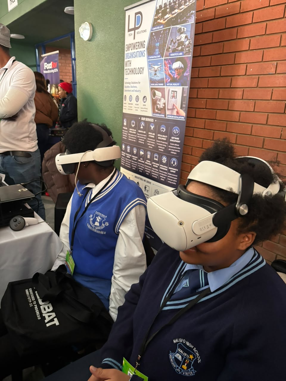 Learners using virtual reality headsets at an LP Tech Solutions school demonstration